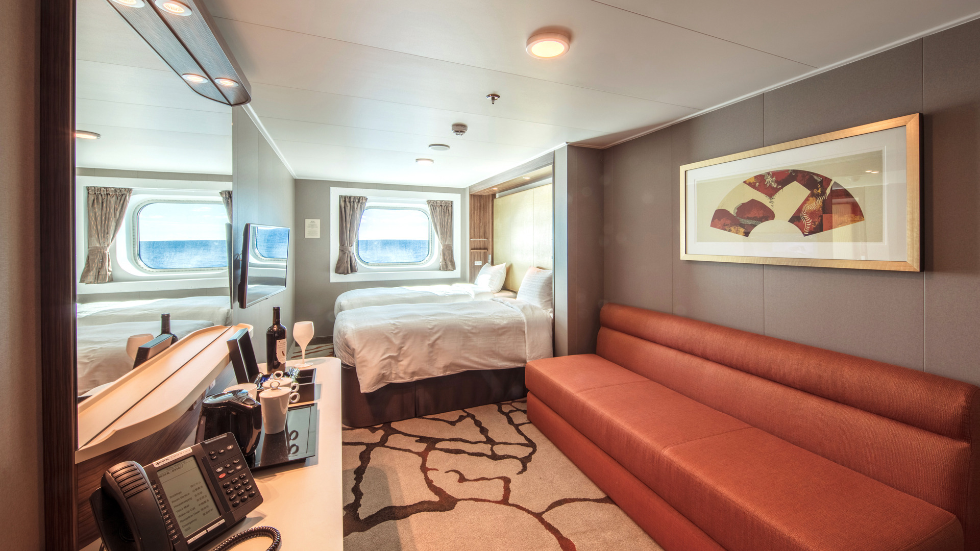 Genting Dream’s cosy Oceanview Stateroom with expansive views of the sea