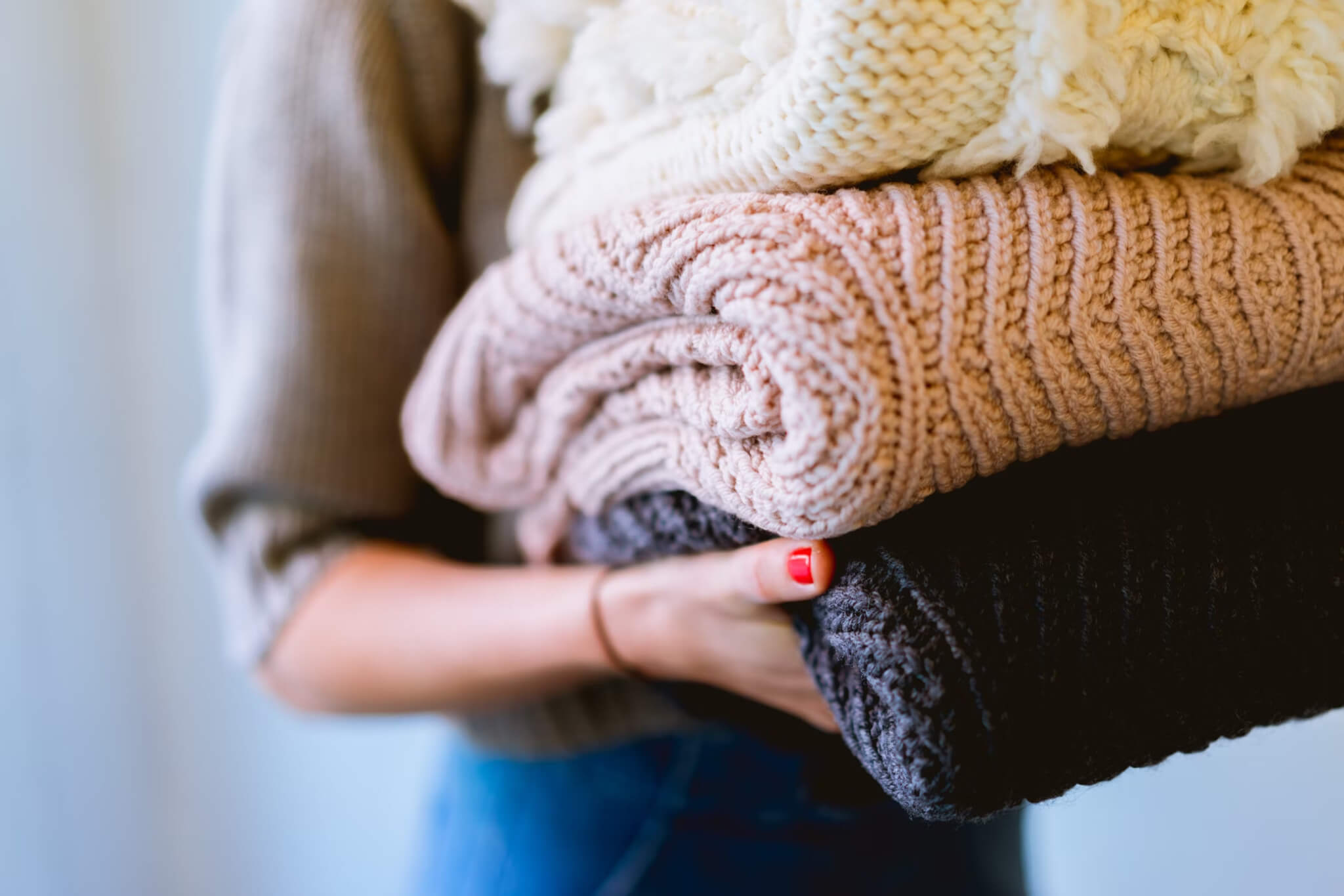 Packing sweaters for the colder climates to keep yourself warm