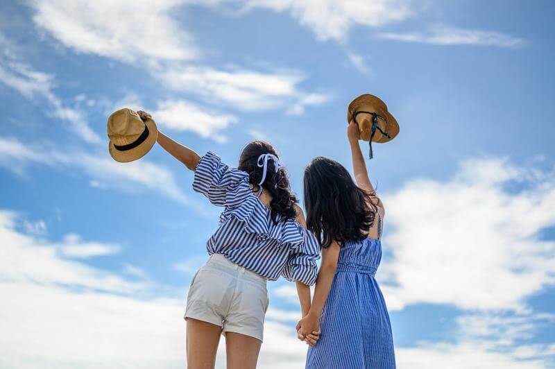 Two women in dressy casual outfits for their cruise vacation