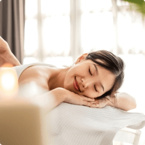 A women enjoying a relaxing and rejuvenating spa onboard